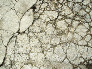 badly cracked asphalt